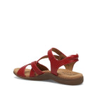 Red sandal with a brown sole on a white background