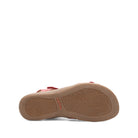 Tan sandal sole with 'taos' branding on a white background