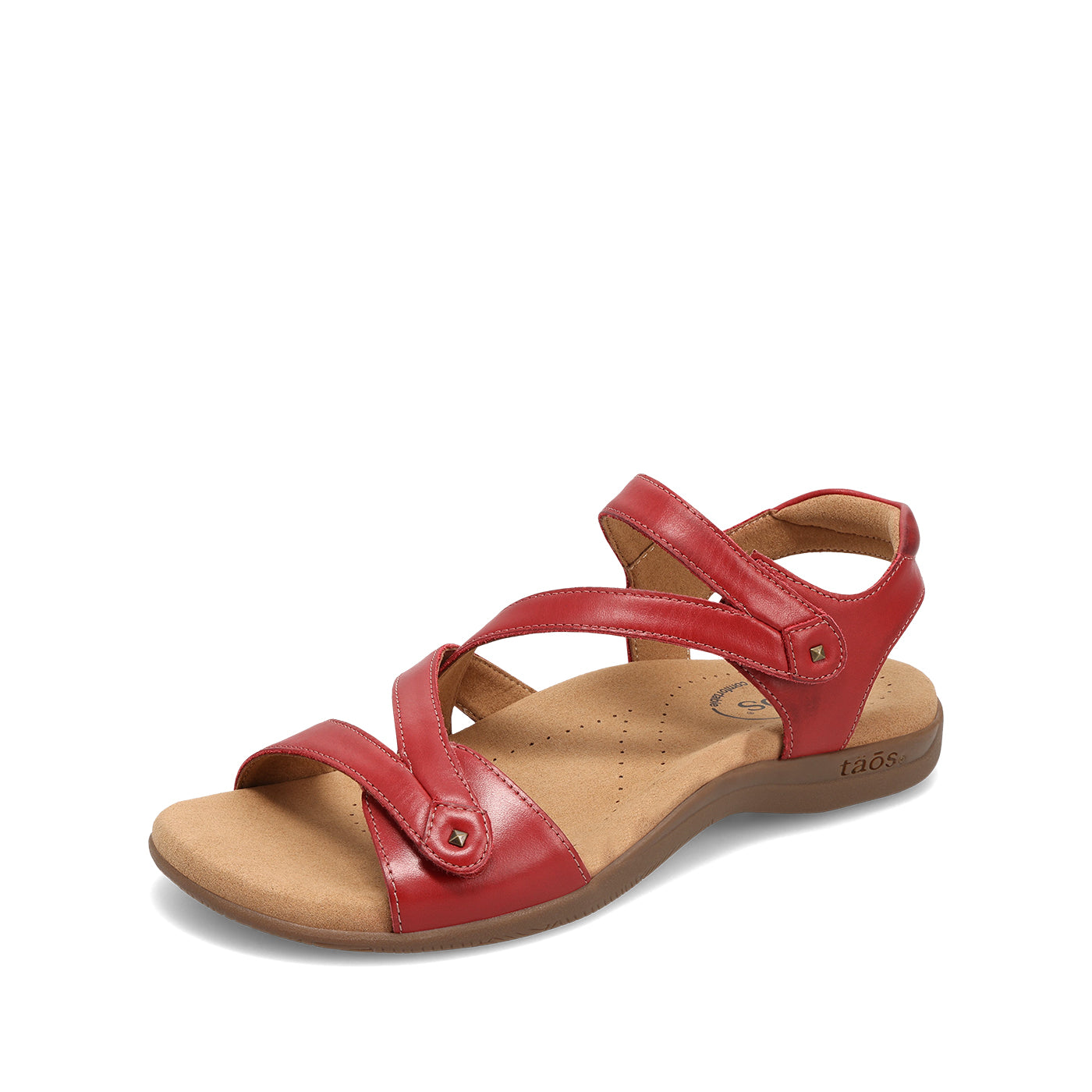 Red sandal with a brown sole on a white background