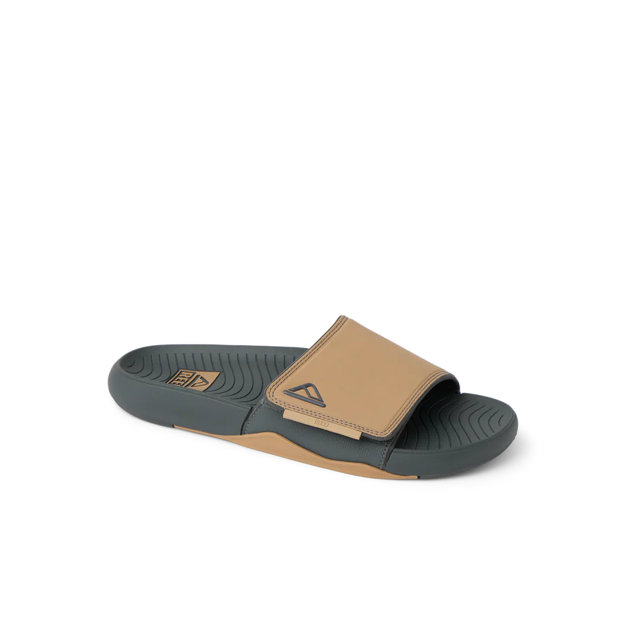 Slide sandal with tan and gray design on a white background