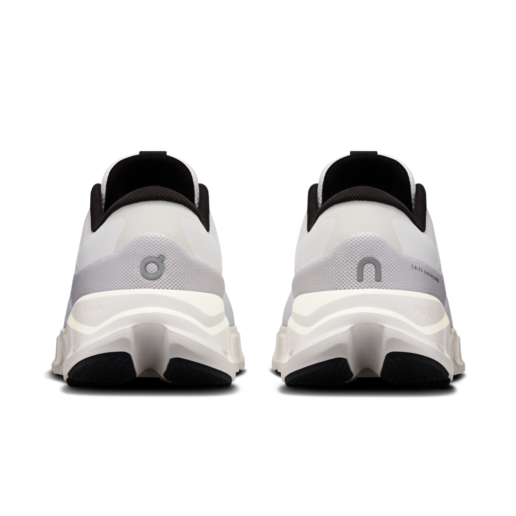 White running shoes with black soles on a white background
