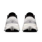White running shoes with black soles on a white background