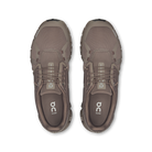 Pair of brown athletic shoes on a white background