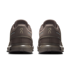 Brown athletic shoes shown from the back on a white background