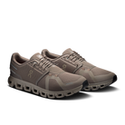 Pair of brown running shoes on a white background
