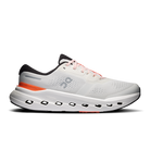 White athletic shoe with black and orange accents on a white background