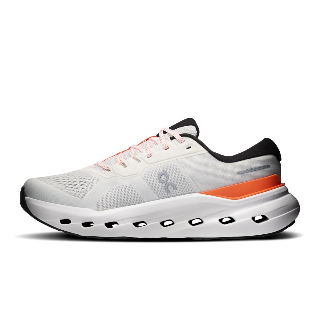 White running shoe with orange accent on a white background