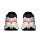 Pair of running shoes with orange accents on a white background