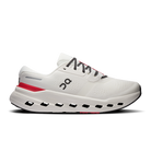 White running shoe with red accents on a white background