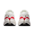 White running shoes with red accents on a white background