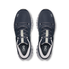 A pair of On Cloudrunning sneakers in navy blue and white, shown from a top-down view on a white background.