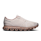 White running shoe with pink accents on a white background