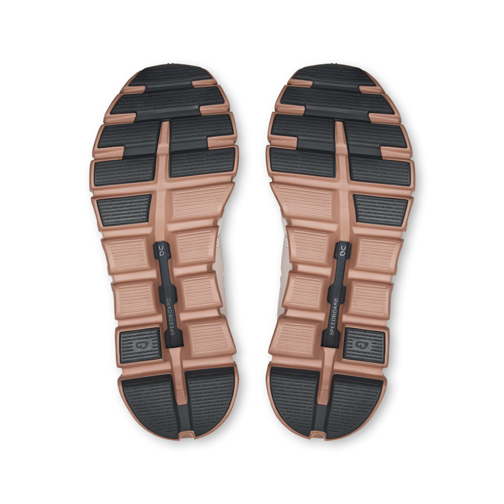 Top view of a pair of brown and black shoes on a white background
