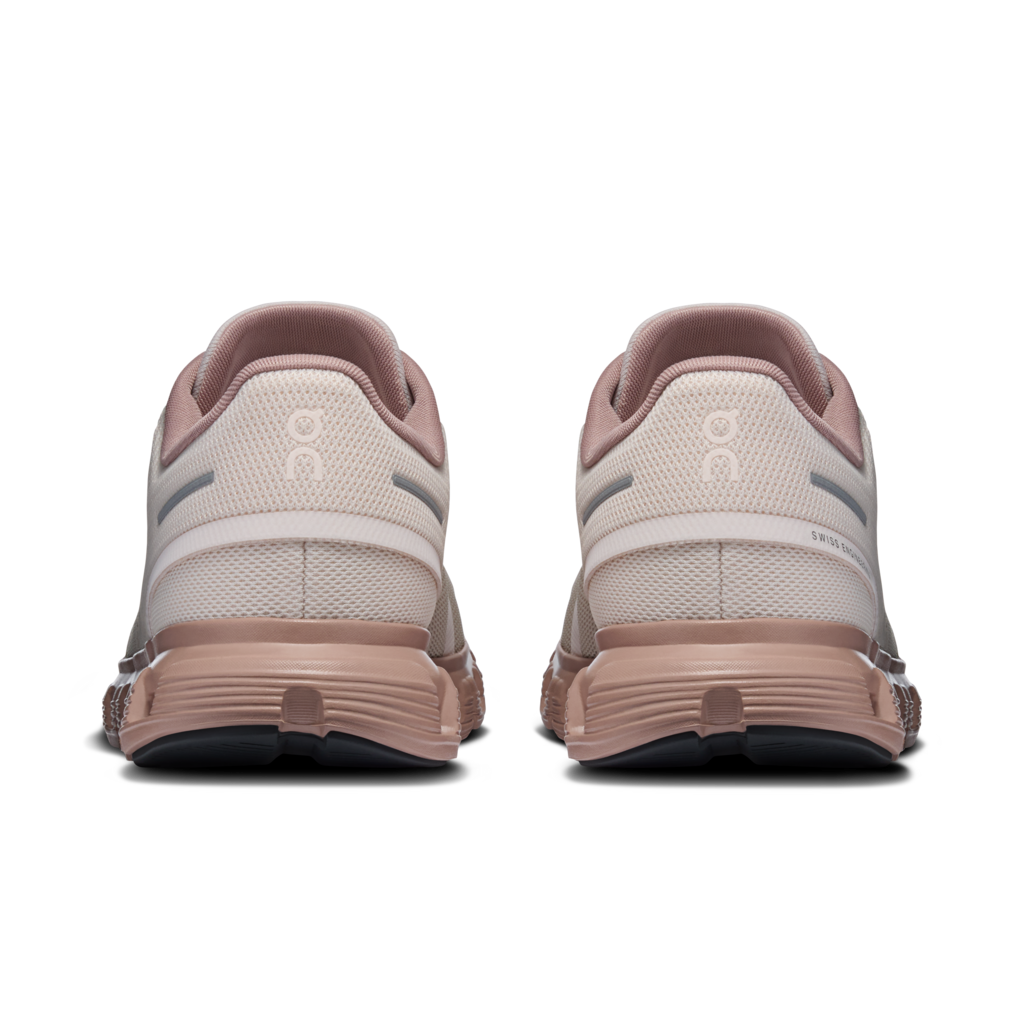 Pair of running shoes shown from the back on a white background