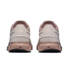Pair of running shoes shown from the back on a white background
