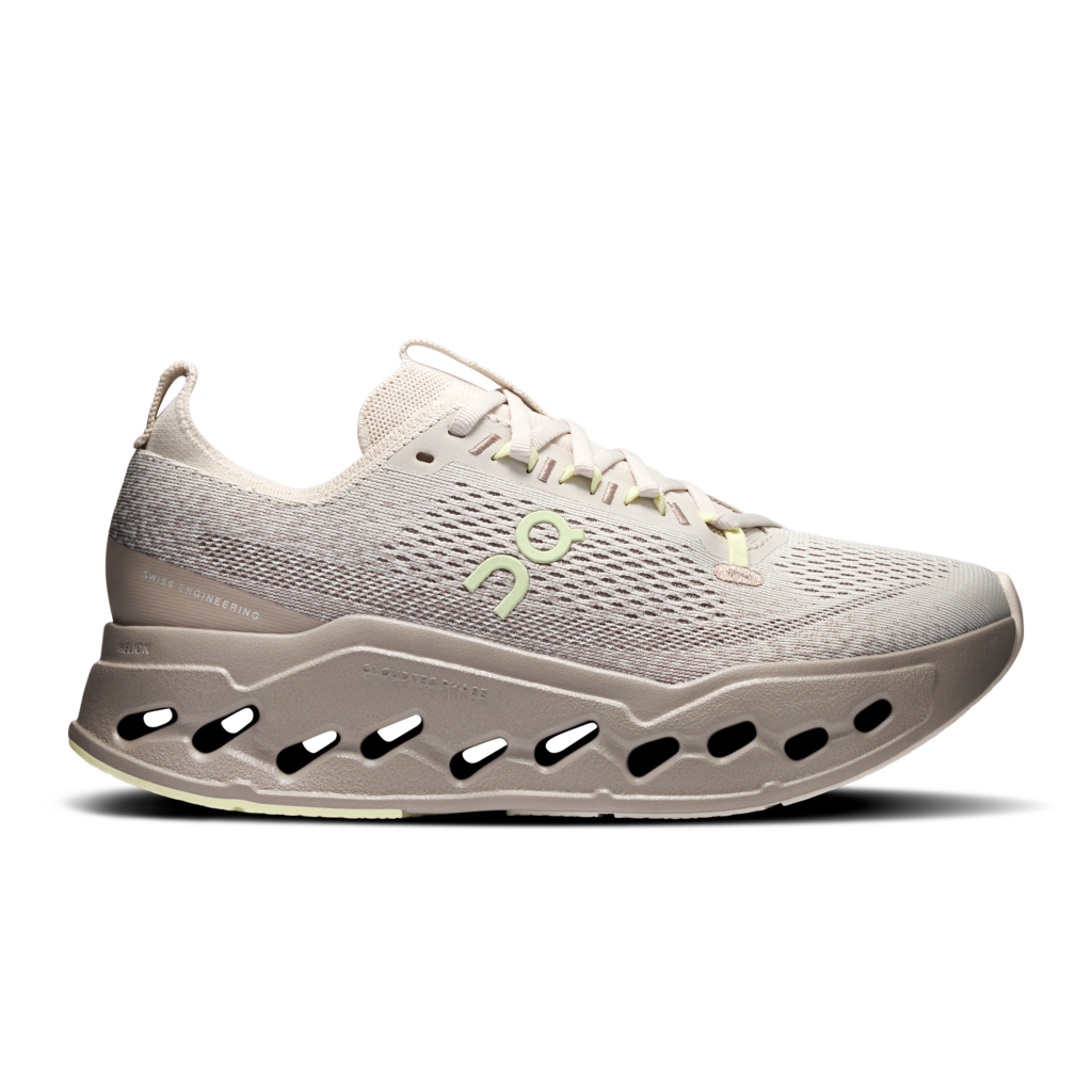 Gray running shoe with a white sole on a white background
