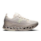Gray running shoe with a white sole on a white background