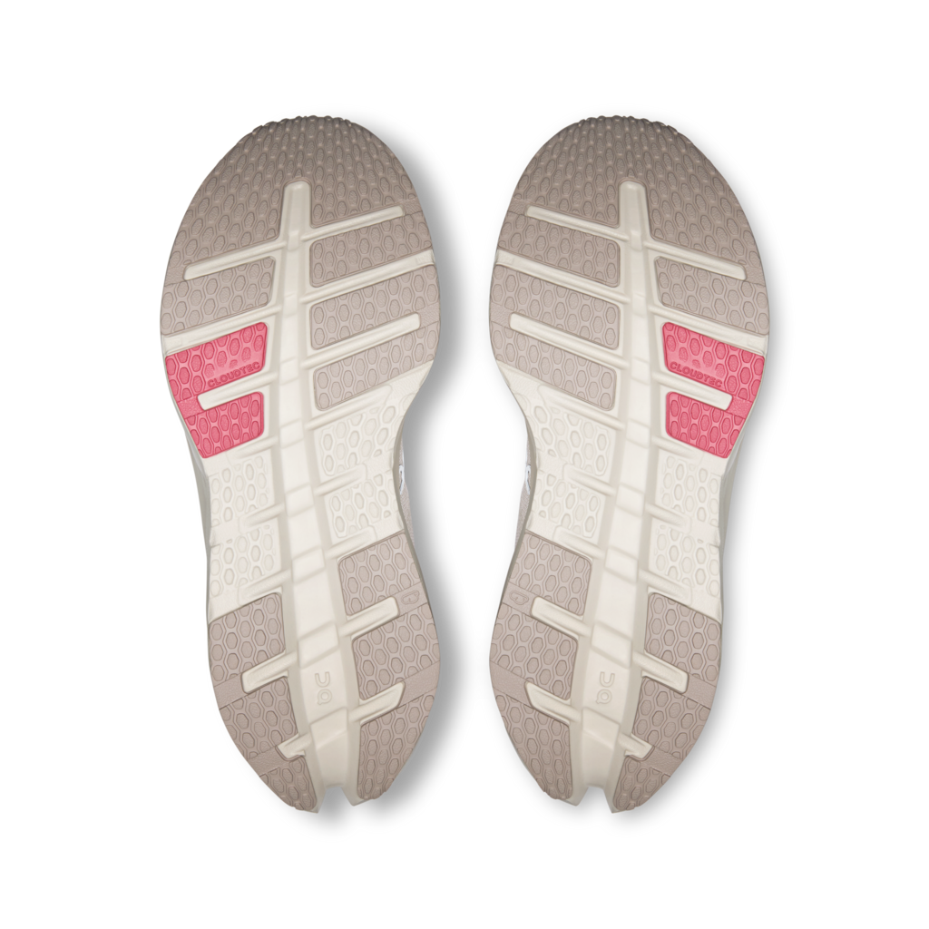 Two shoe soles with a pink sole liner on a white background