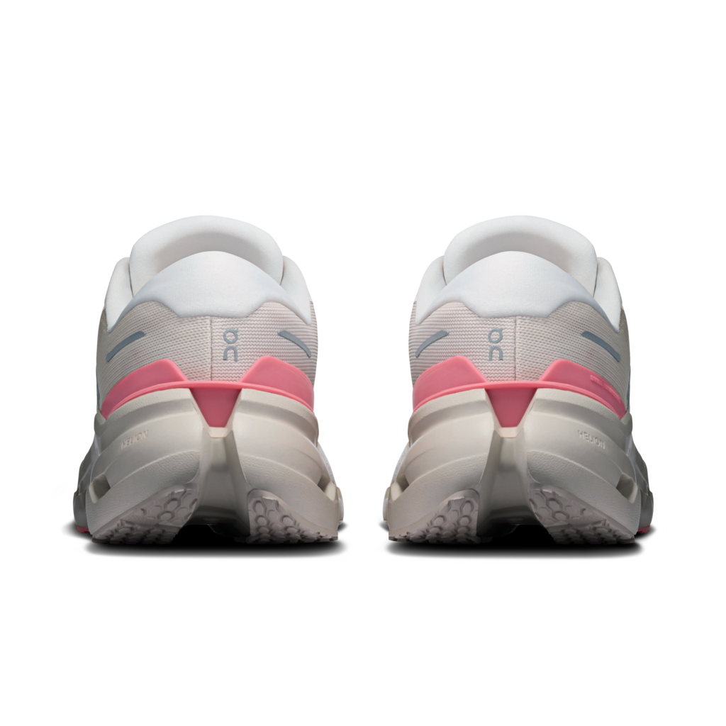 White and pink running shoes on a white background