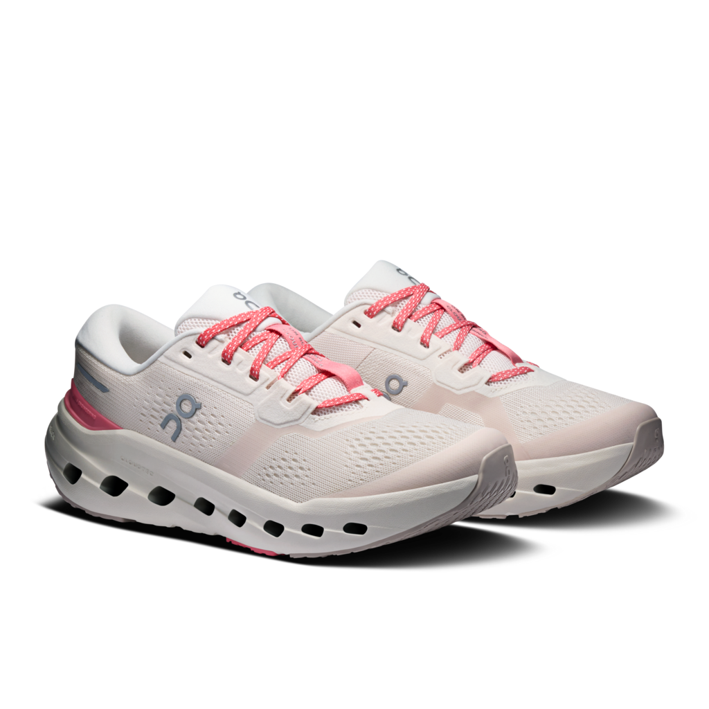 White running shoes with pink laces on a white background