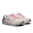 White running shoes with pink laces on a white background