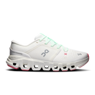 A white On running shoe with mint green laces, a gray On logo, a small pink X logo, and pink accents on the midsole and toe cap, shown against a plain white background.
