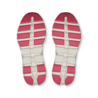 A pair of athletic shoe soles viewed from above, featuring a white textured midsole with bright pink textured outsole blocks.