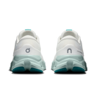 A pair of On running shoes shown from the back, featuring a white upper, a translucent mint green midsole, and teal outsole details.