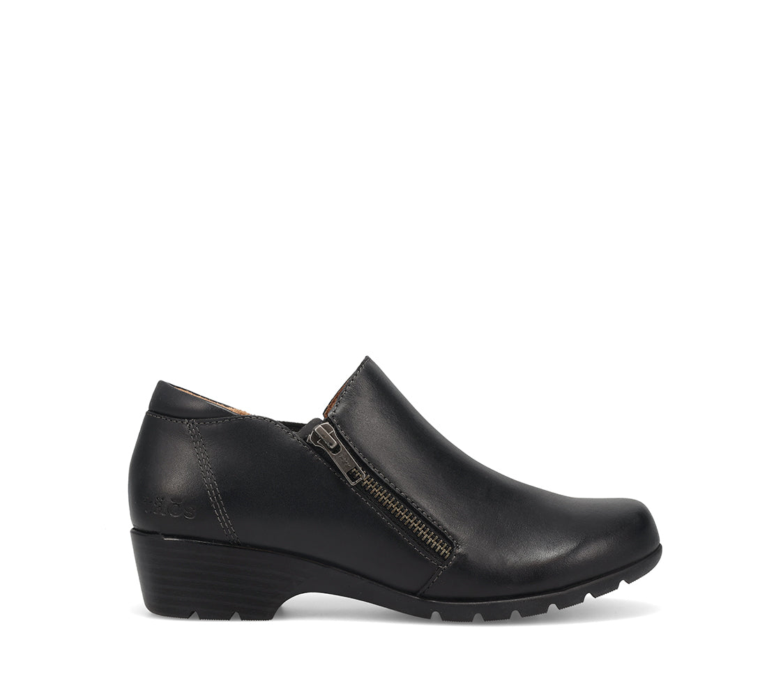 A black leather slip-on wedge shoe with a side zipper, shown in profile against a plain white background.