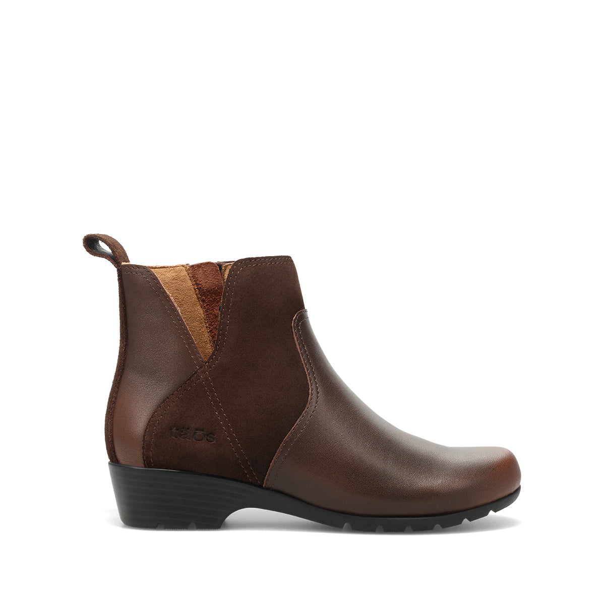 A dark brown leather ankle boot with a black wedge sole, shown in a side profile on a white background. The boot features contrast stitching, elastic side panels, and a pull tab at the heel.
