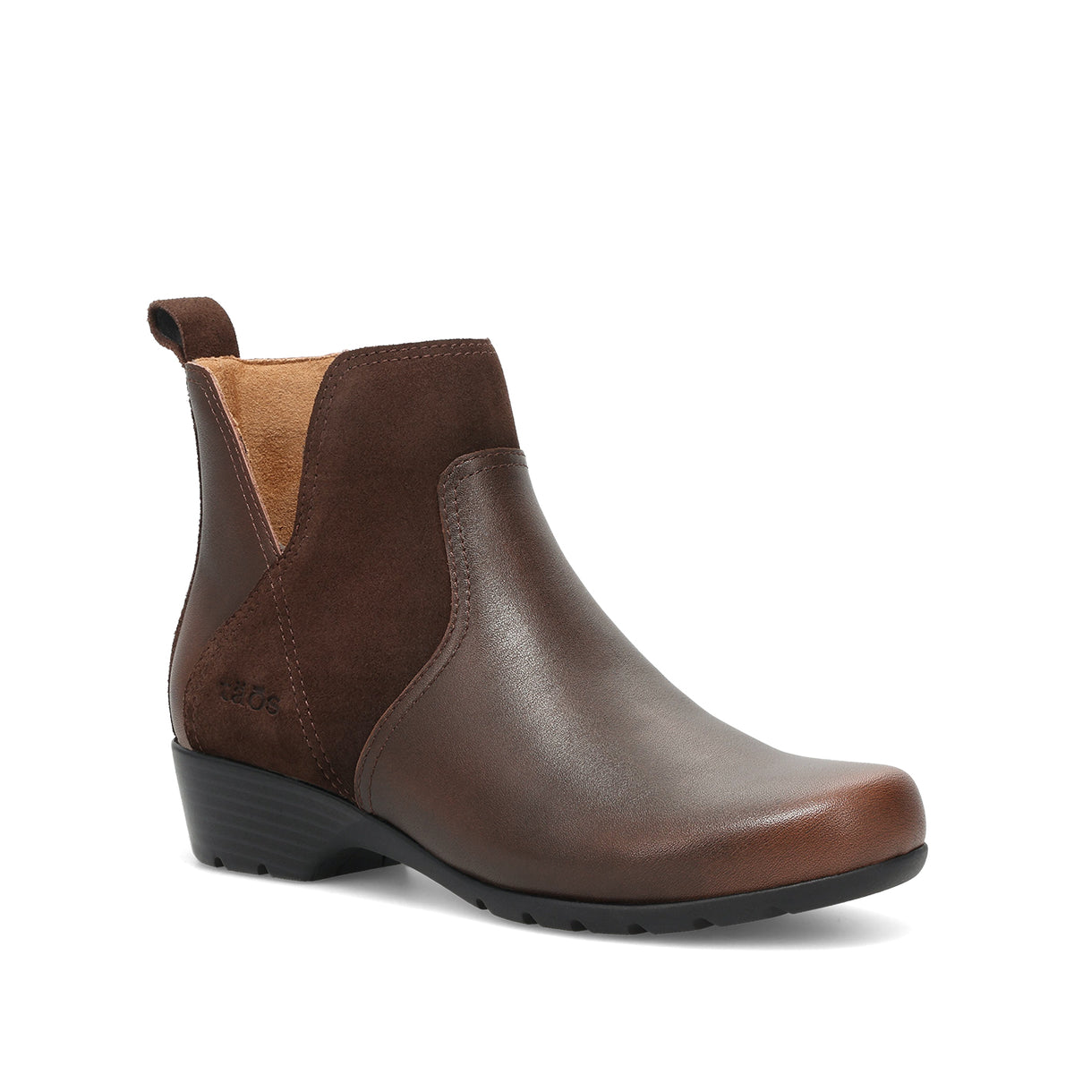 A dark brown leather Chelsea-style ankle boot with a black wedge heel and a tan interior lining, shown from a three-quarters angle on a white background.