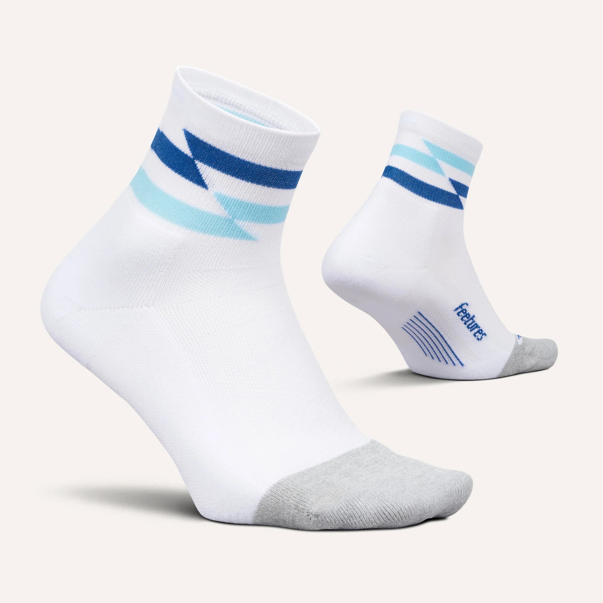White socks with blue and gray stripes on a light gray background