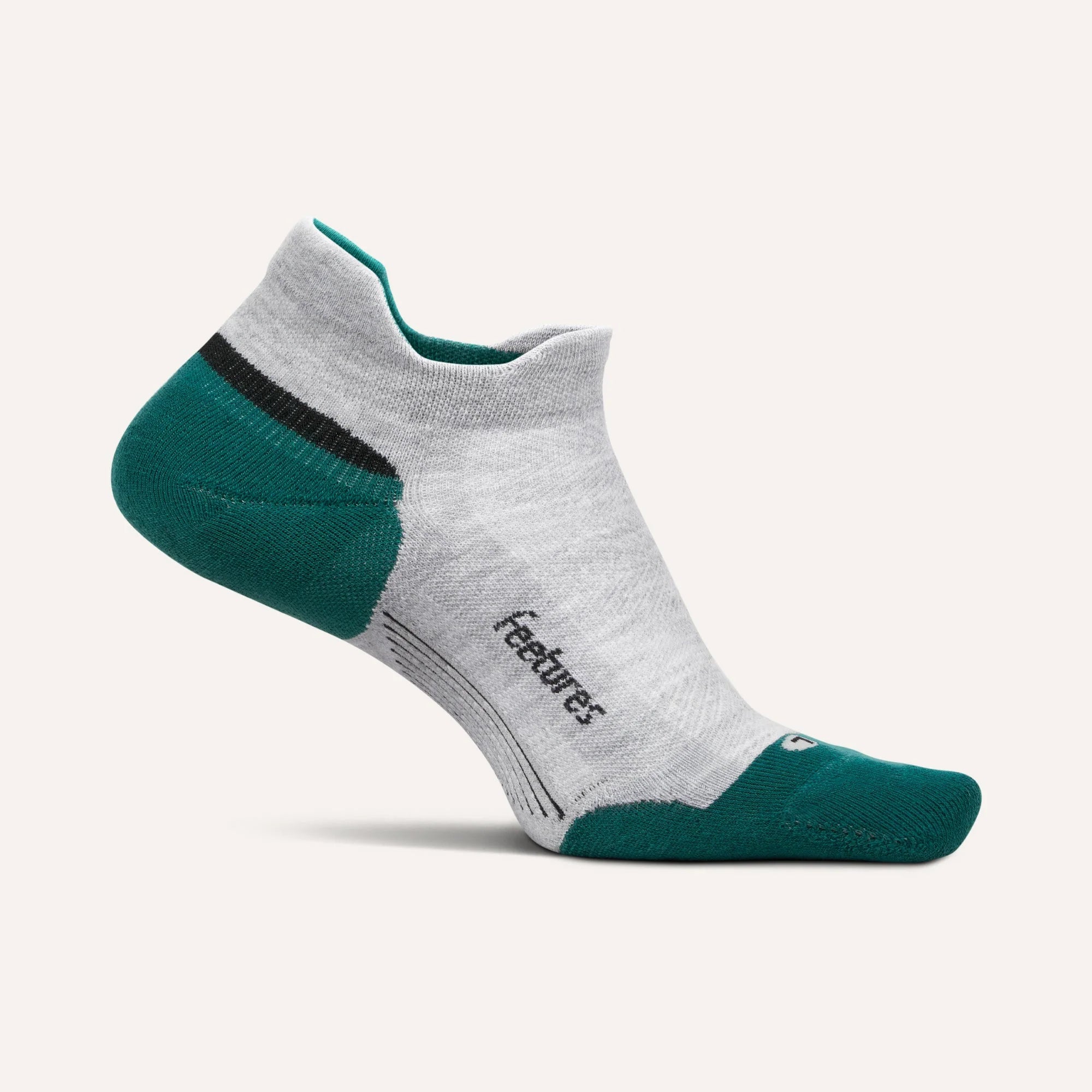 Gray and green ankle sock with 'feetures' branding on a light gray background
