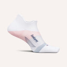 White ankle sock with pink heel and sole on a light gray background
