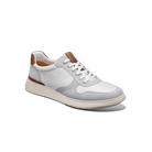 White sneaker with brown accents on a white background