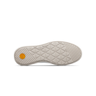 Close-up of a shoe sole with a textured pattern on a white background