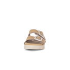 Beige sandal with a buckle on a white background