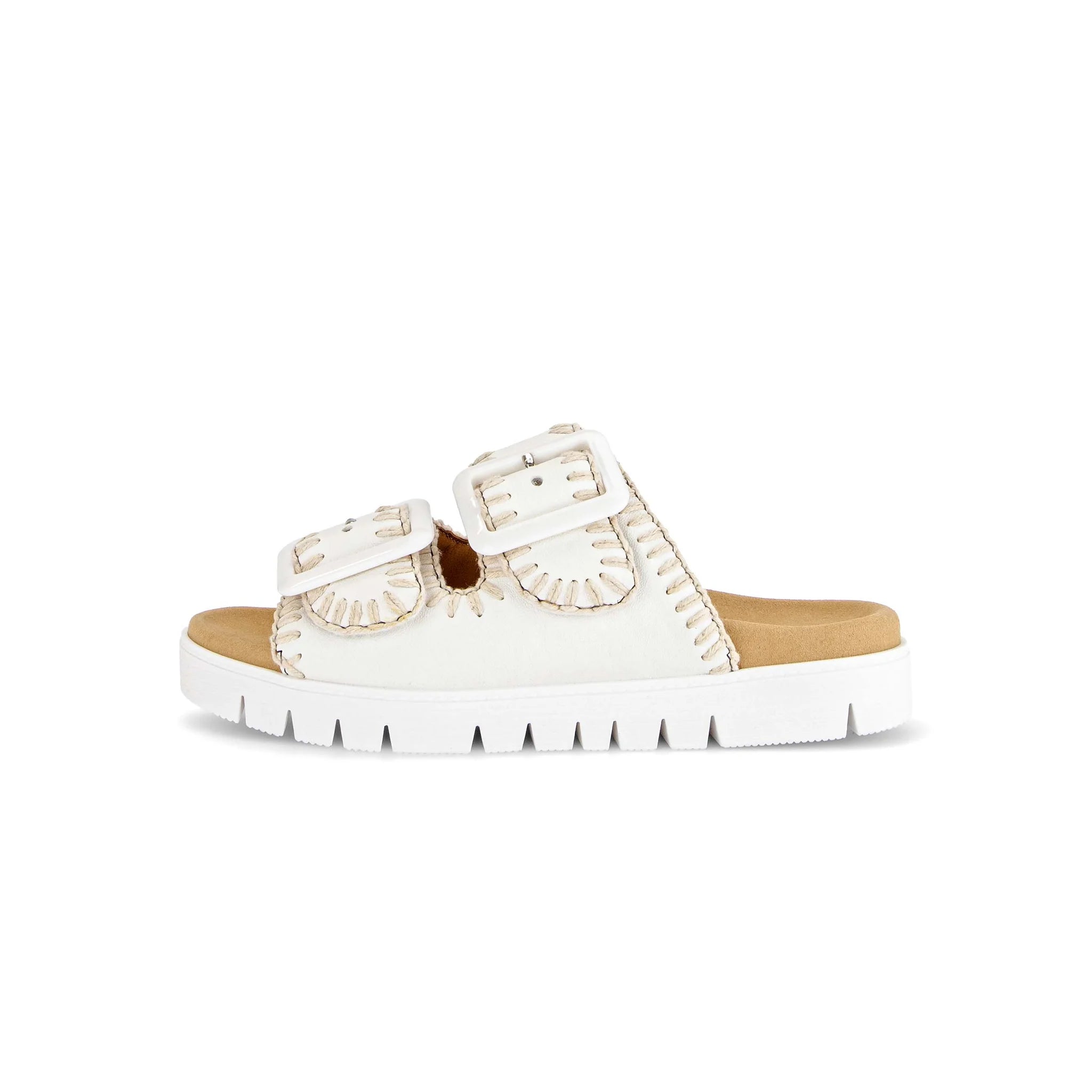 White sandal with brown sole on a white background