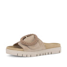 Beige sandal with a beaded design on a white background