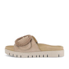 Beige sandal with a beaded design on a white background