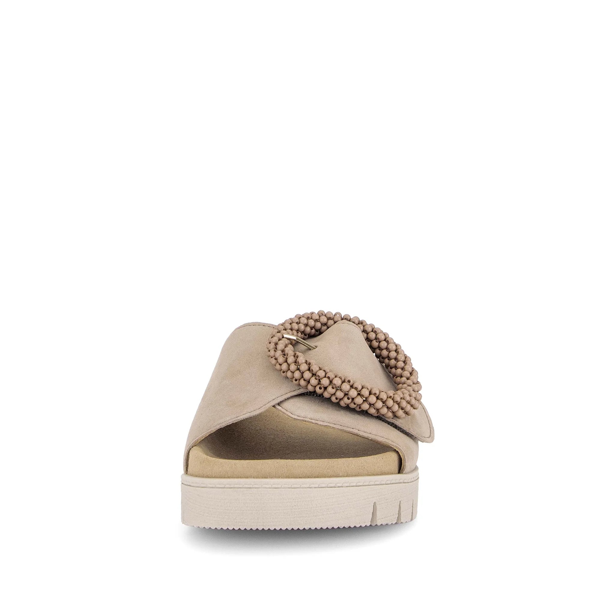 Beige sandal with beaded detail on a white background