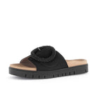 Black sandal with beaded design on a white background