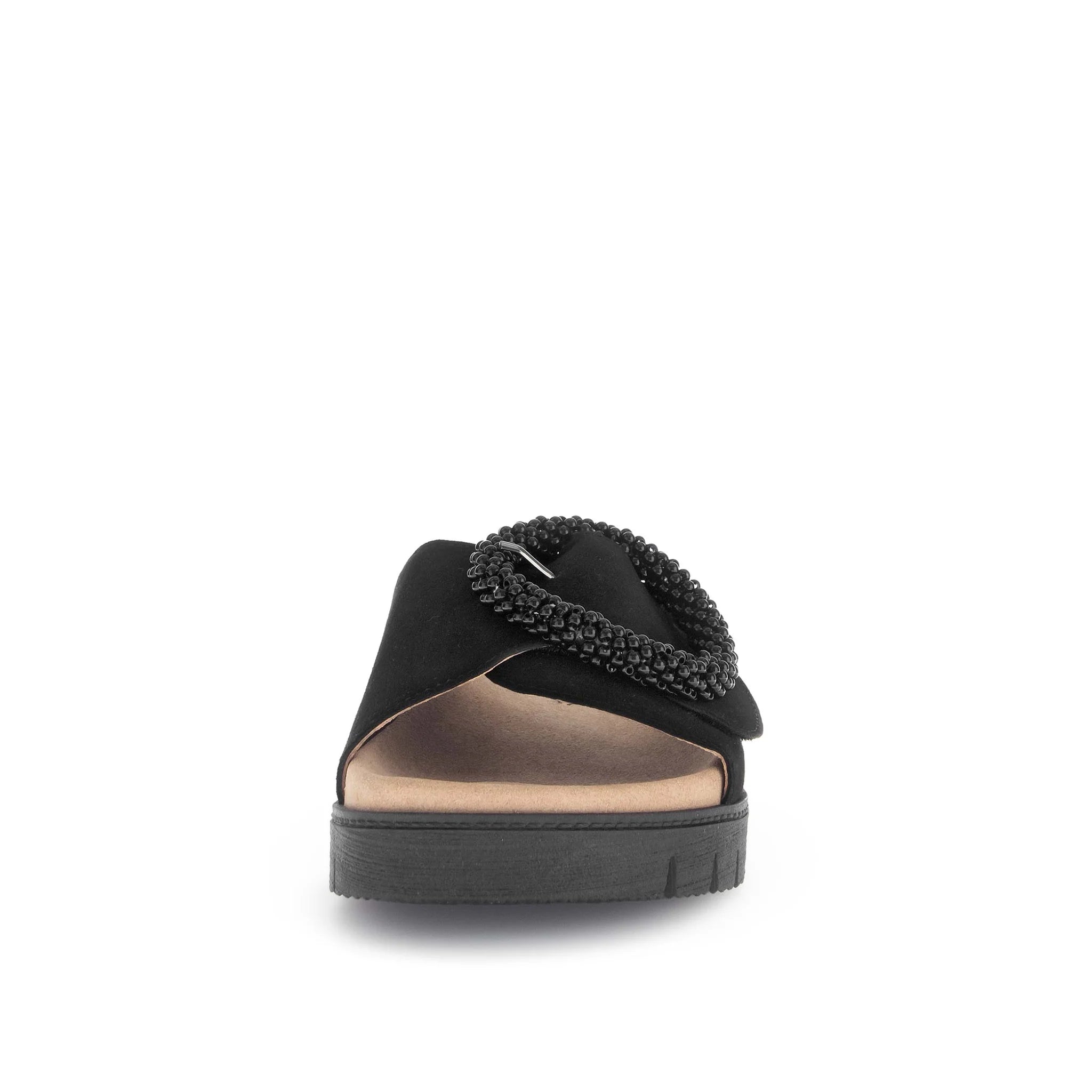 Black sandal with embellishments on a white background