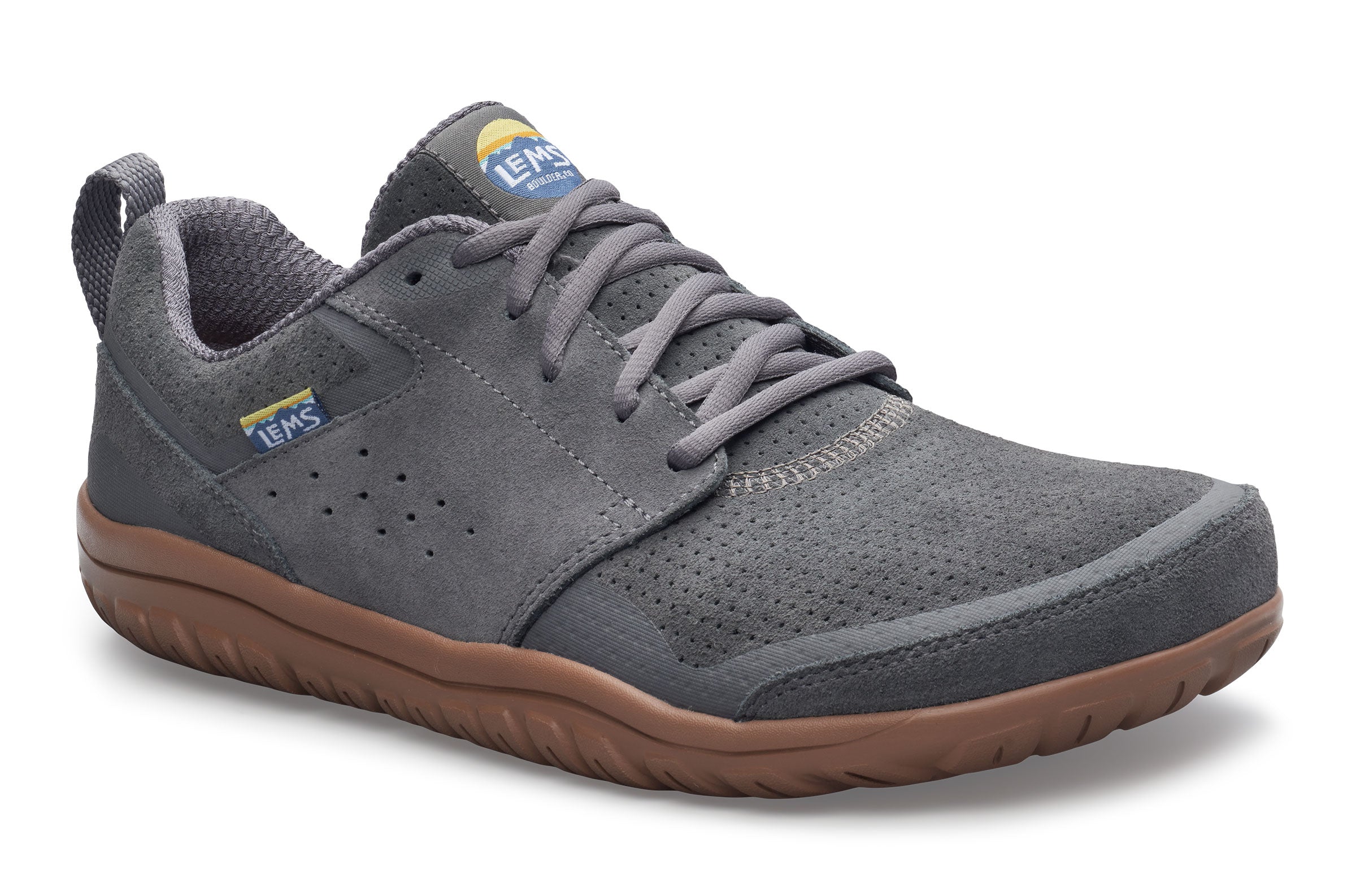 Gray sneaker with brown sole on a white background