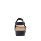 Black sandal with cork sole on a white background