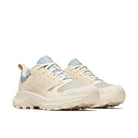 Beige and blue sneakers on a white background