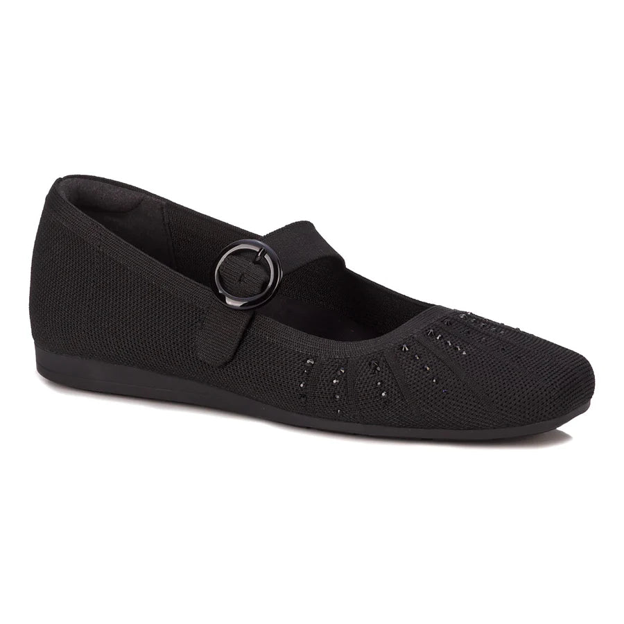 Black flat shoe with a buckle on a white background