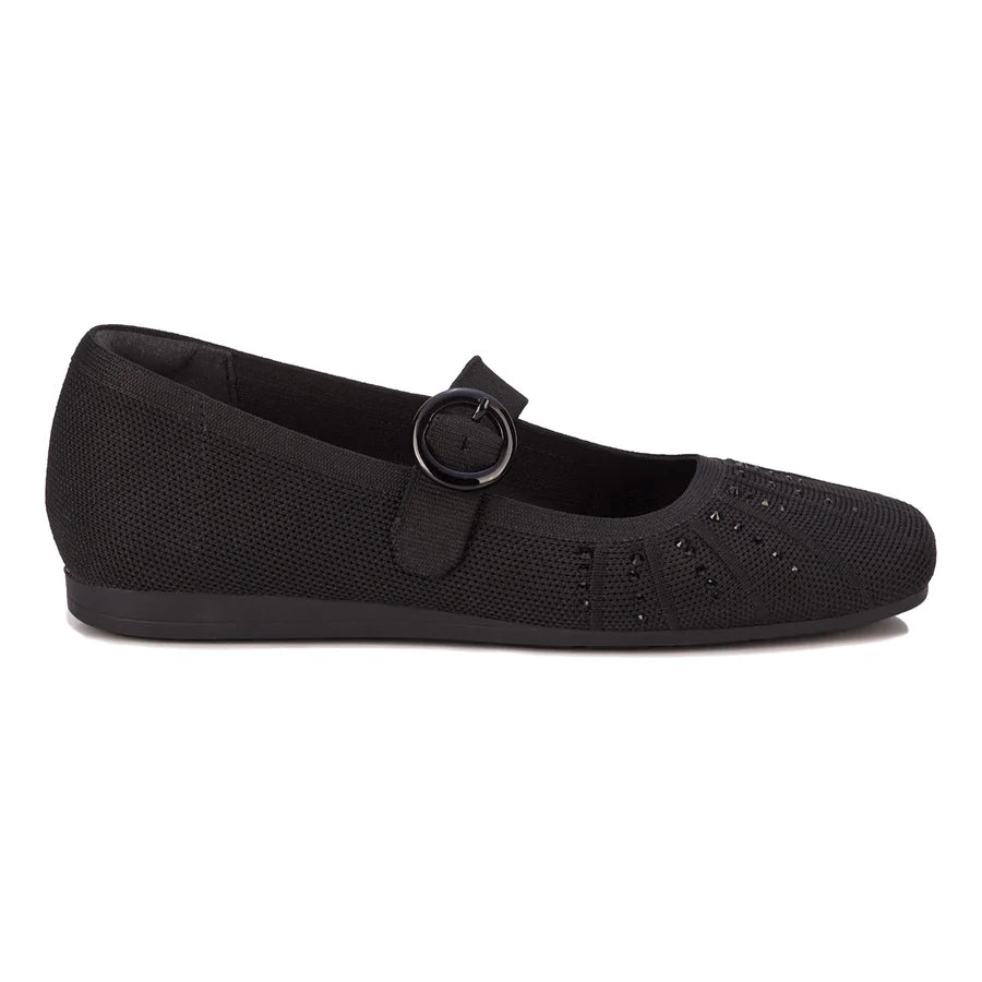 Black slip-on shoe on a white background