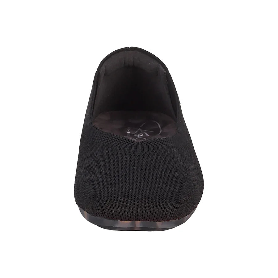 Black slip-on shoe on a white background