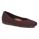 Brown woven flat shoe on a white background